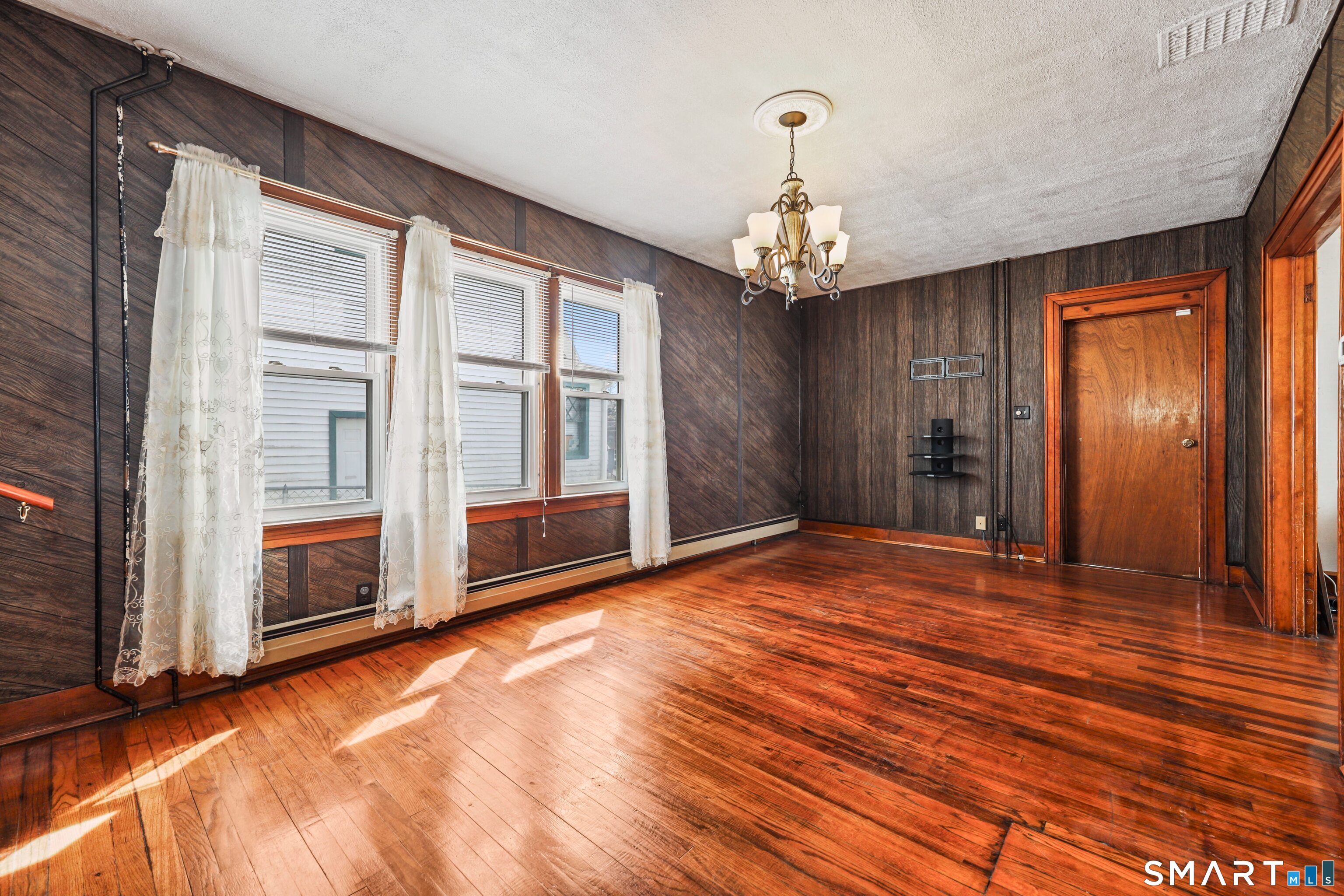 33 West View Street Waterbury, CT 06706 - Photo 5 of 29 a view of an empty room with a window and a kitchen