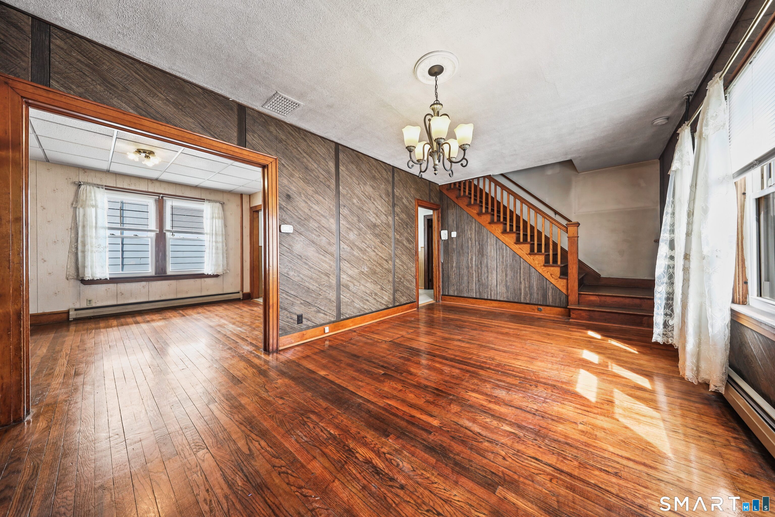 33 West View Street Waterbury, CT 06706 - Photo 6 of 29 a view of empty room with wooden floor and fan