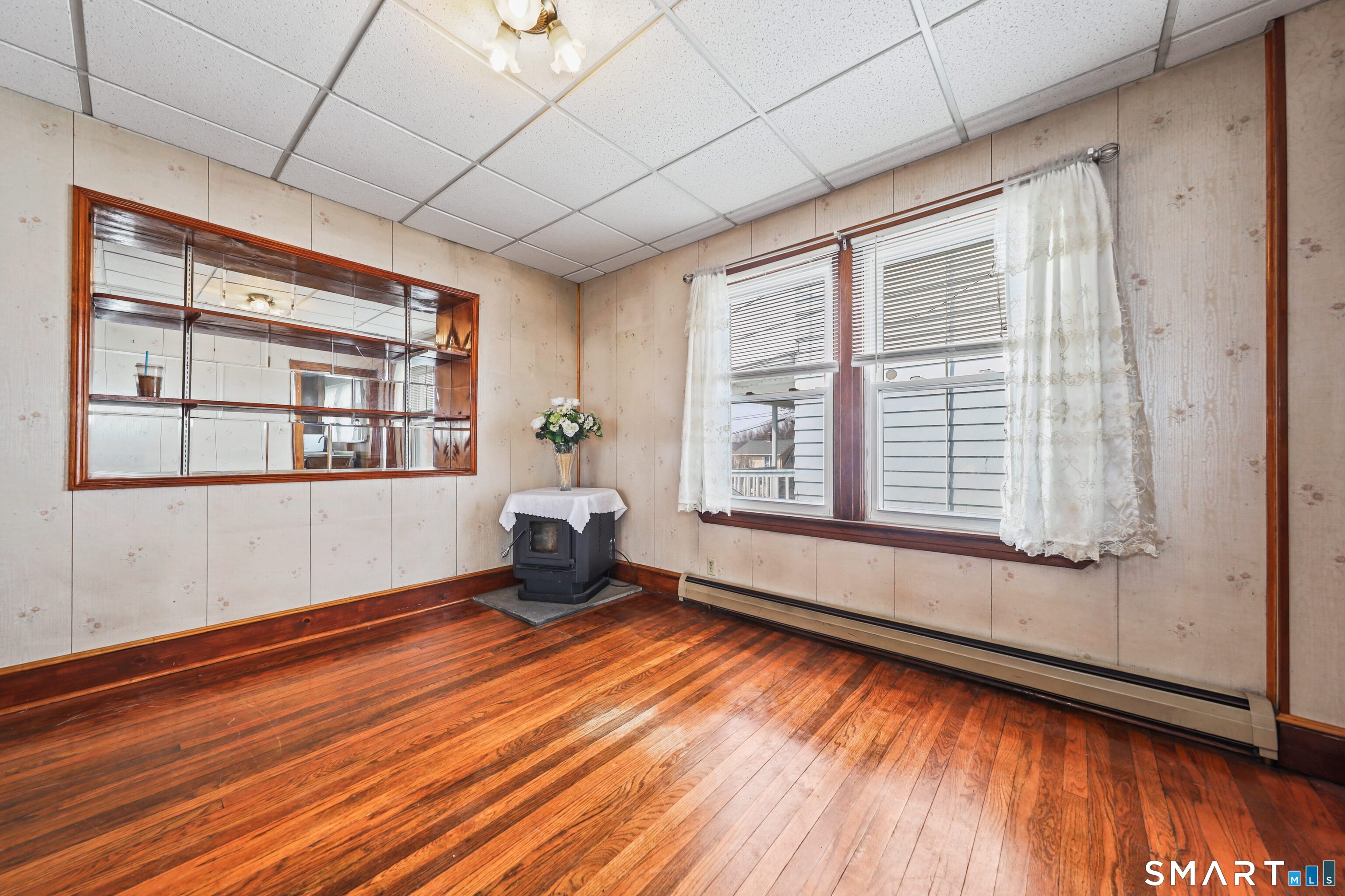 33 West View Street Waterbury, CT 06706 - Photo 7 of 29 a view of an empty room with a window and wooden floor