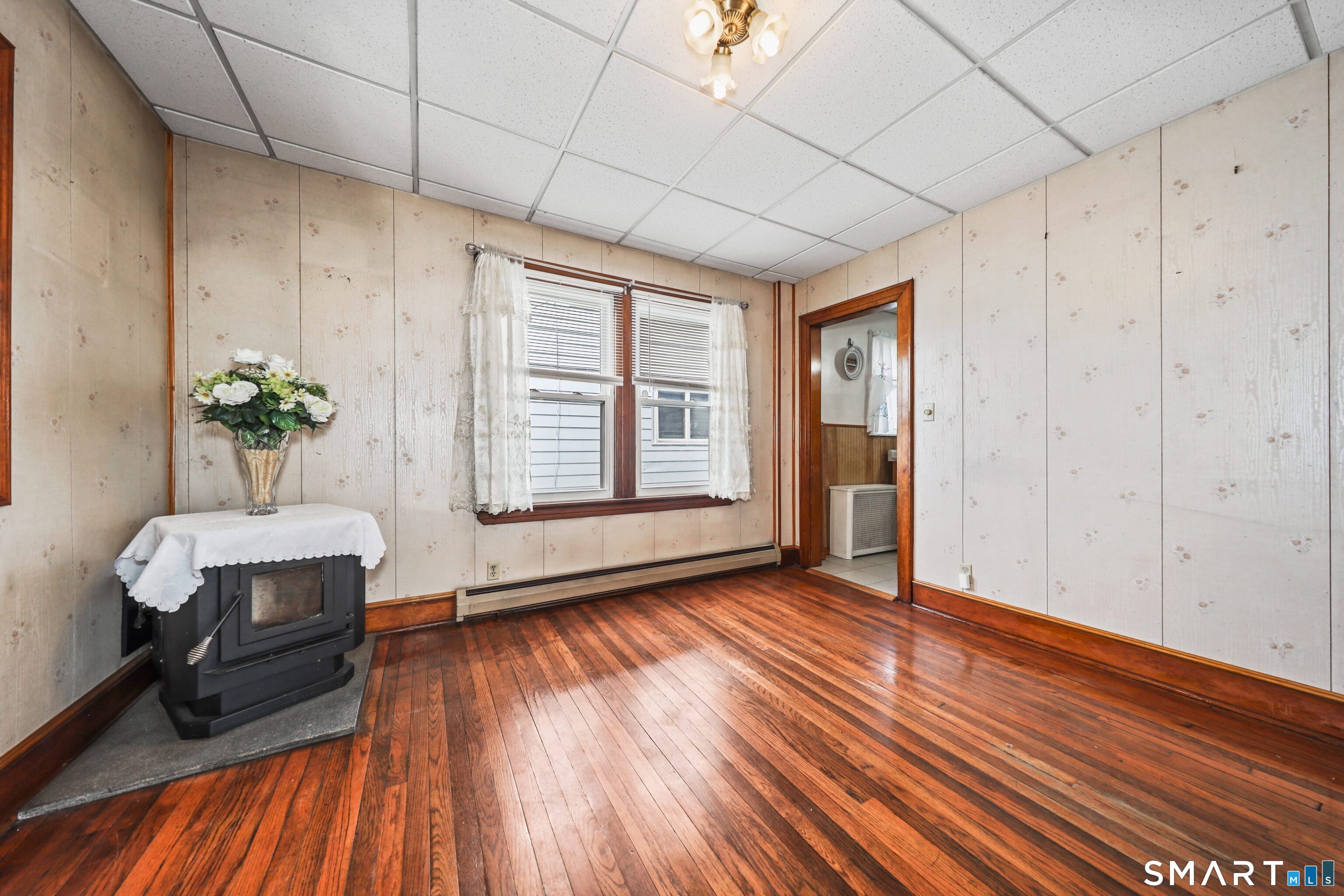33 West View Street Waterbury, CT 06706 - Photo 8 of 29 a view of an empty room with wooden floor and a window
