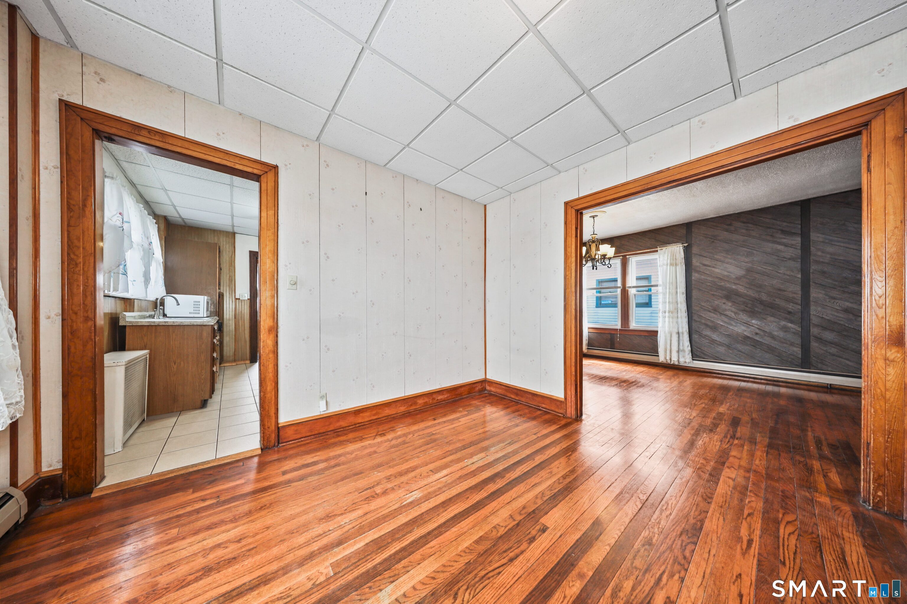 33 West View Street Waterbury, CT 06706 - Photo 9 of 29 a view of a hallway with wooden floor and a bathroom
