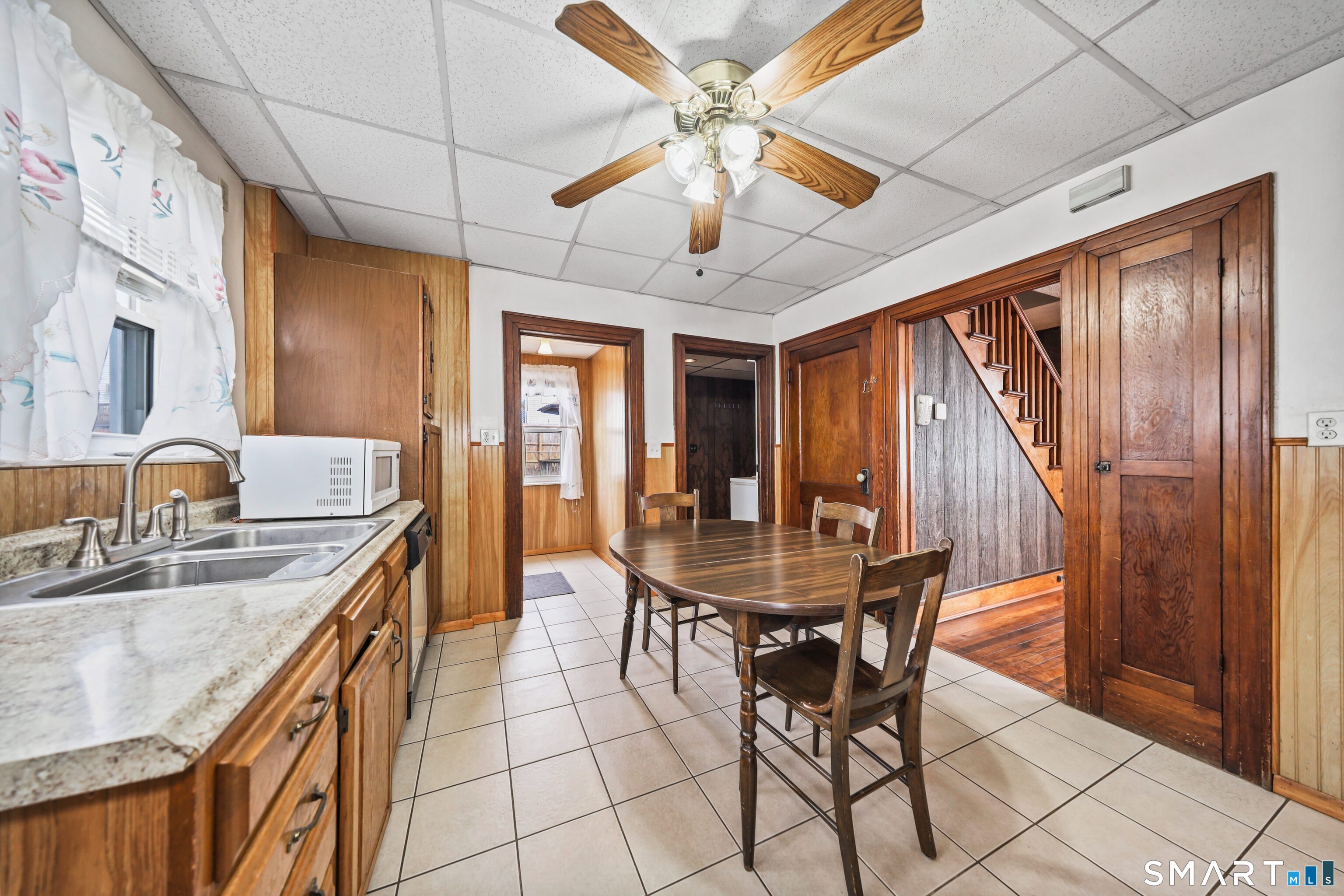33 West View Street Waterbury, CT 06706 - Photo 10 of 29 a kitchen with stainless steel appliances granite countertop a sink a stove cabinets dining table and chairs