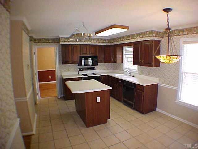 2320 Declaration Drive Raleigh, NC 27615 - Photo 5 of 10 a kitchen with a cabinets and a sink