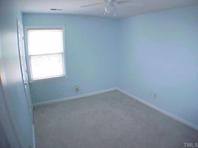2320 Declaration Drive Raleigh, NC 27615 - Photo 7 of 10 an empty room with a window