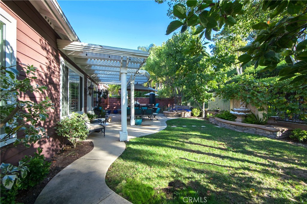 4 Sutherland Drive Ladera Ranch, CA 92694 - Photo 14 of 28 a view of a house with a backyard and a patio