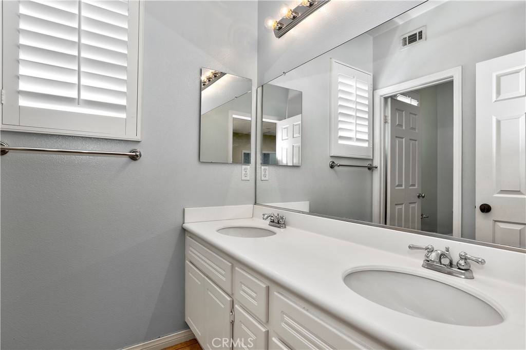 4 Sutherland Drive Ladera Ranch, CA 92694 - Photo 18 of 28 a bathroom with a sink and a mirror