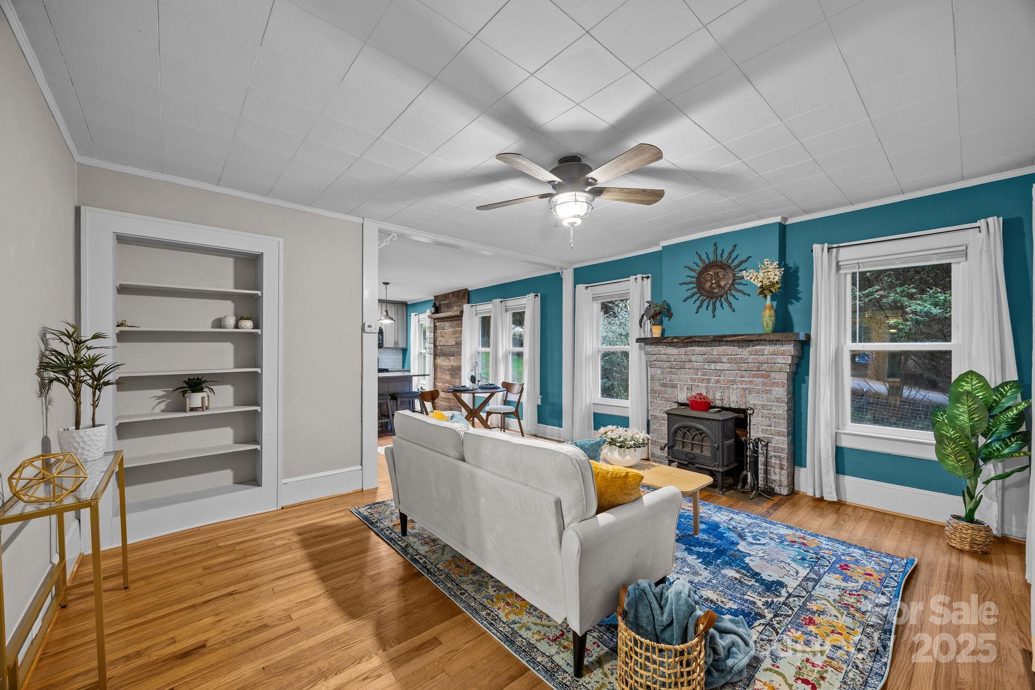 300 Gap Creek Road Fletcher, NC 28732 - Photo 13 of 48 a living room with furniture and a fireplace