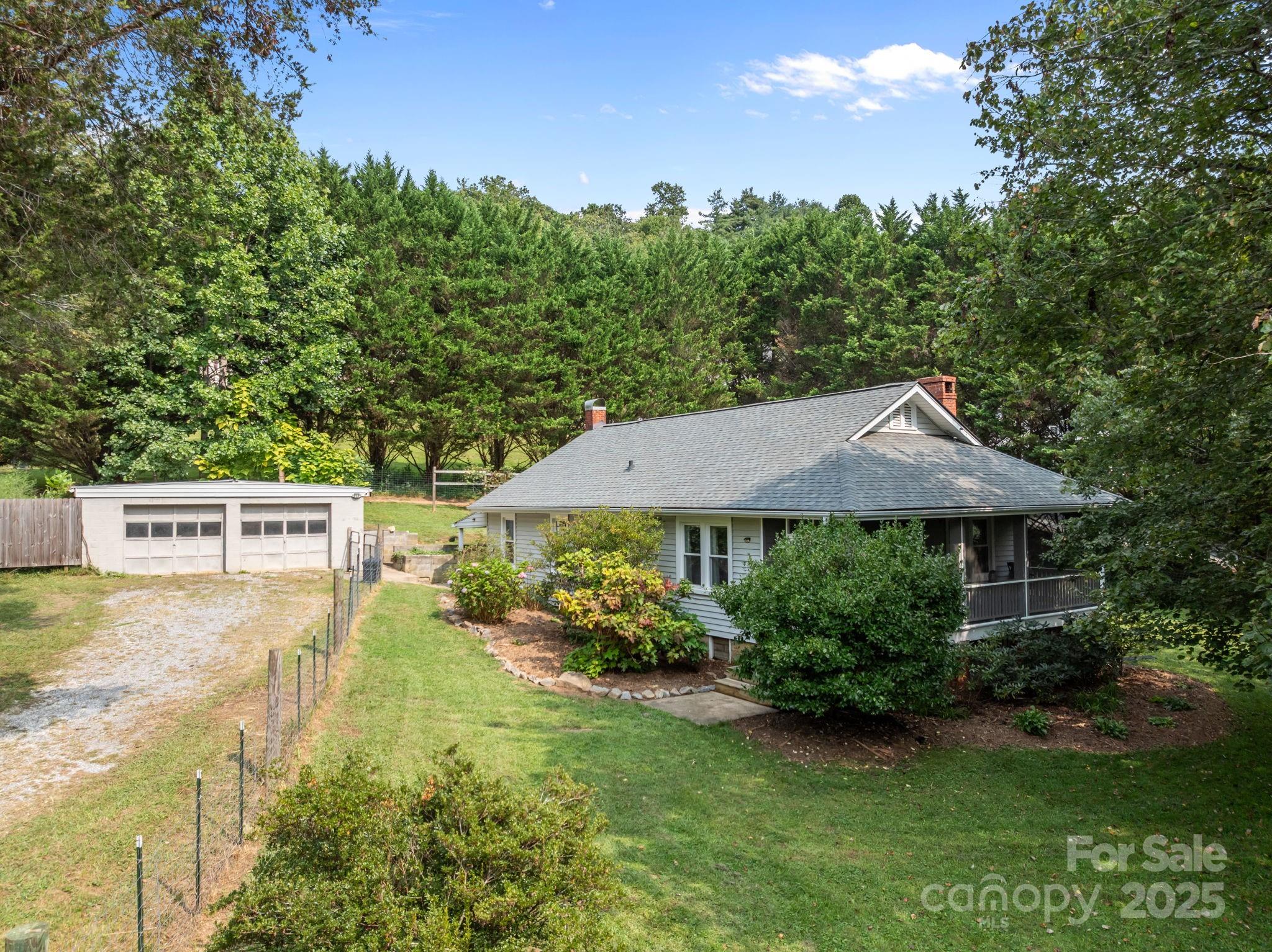 300 Gap Creek Road Fletcher, NC 28732 - Photo 2 of 48 a aerial view of a house with garden