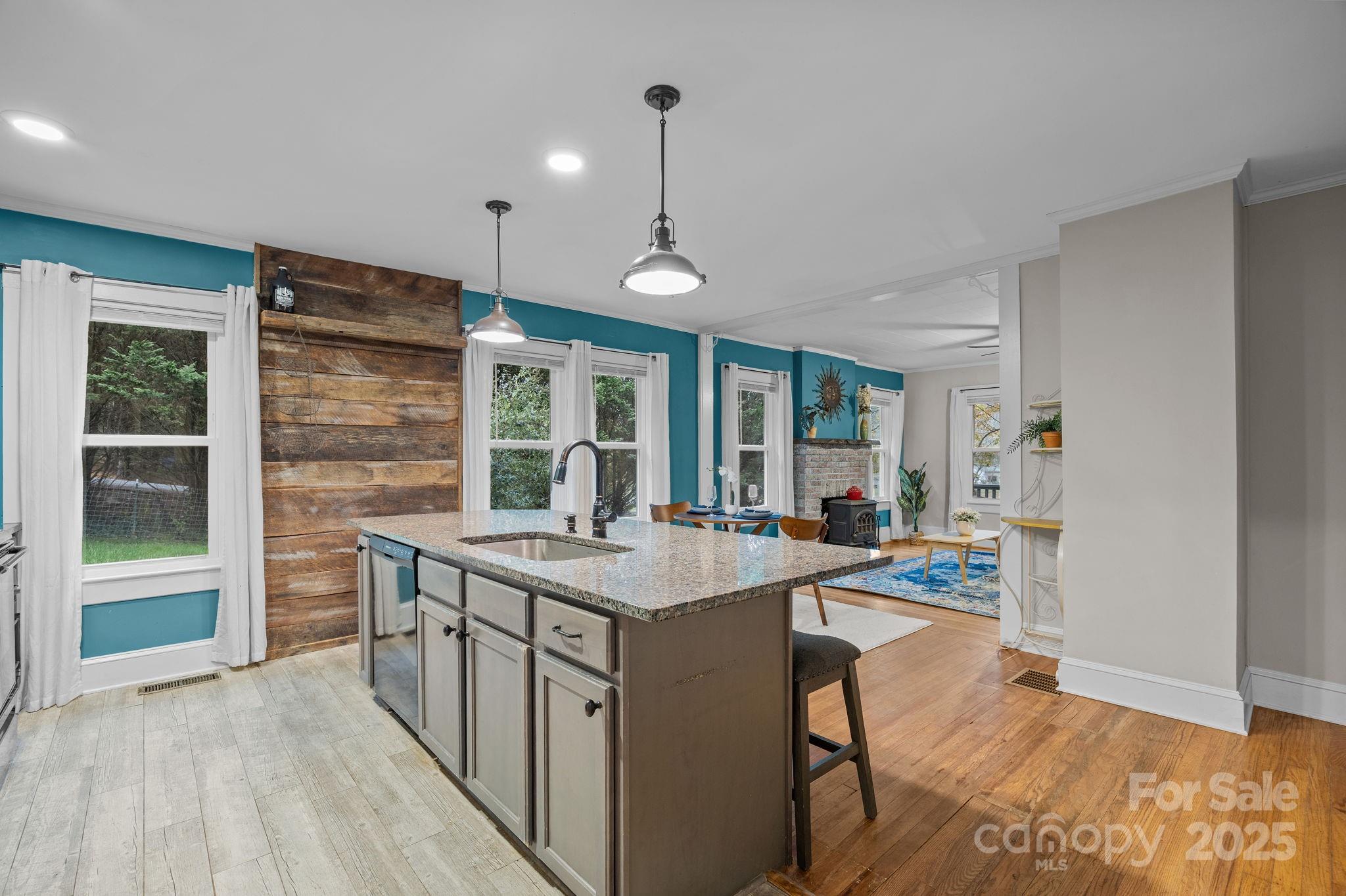 300 Gap Creek Road Fletcher, NC 28732 - Photo 22 of 48 a kitchen with stainless steel appliances granite countertop a stove and a wooden floors