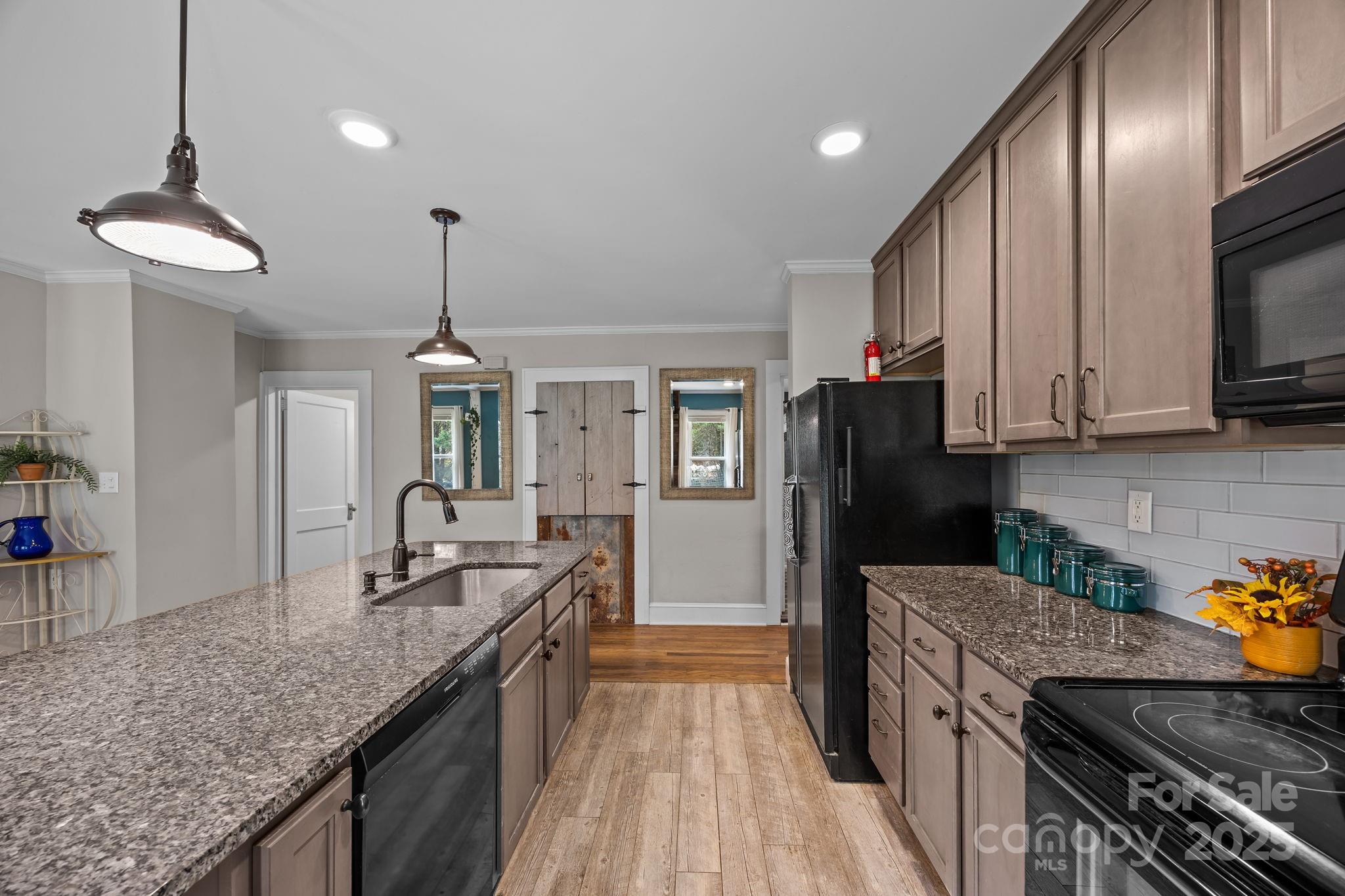 300 Gap Creek Road Fletcher, NC 28732 - Photo 24 of 48 a kitchen with stainless steel appliances granite countertop a sink a stove and a refrigerator
