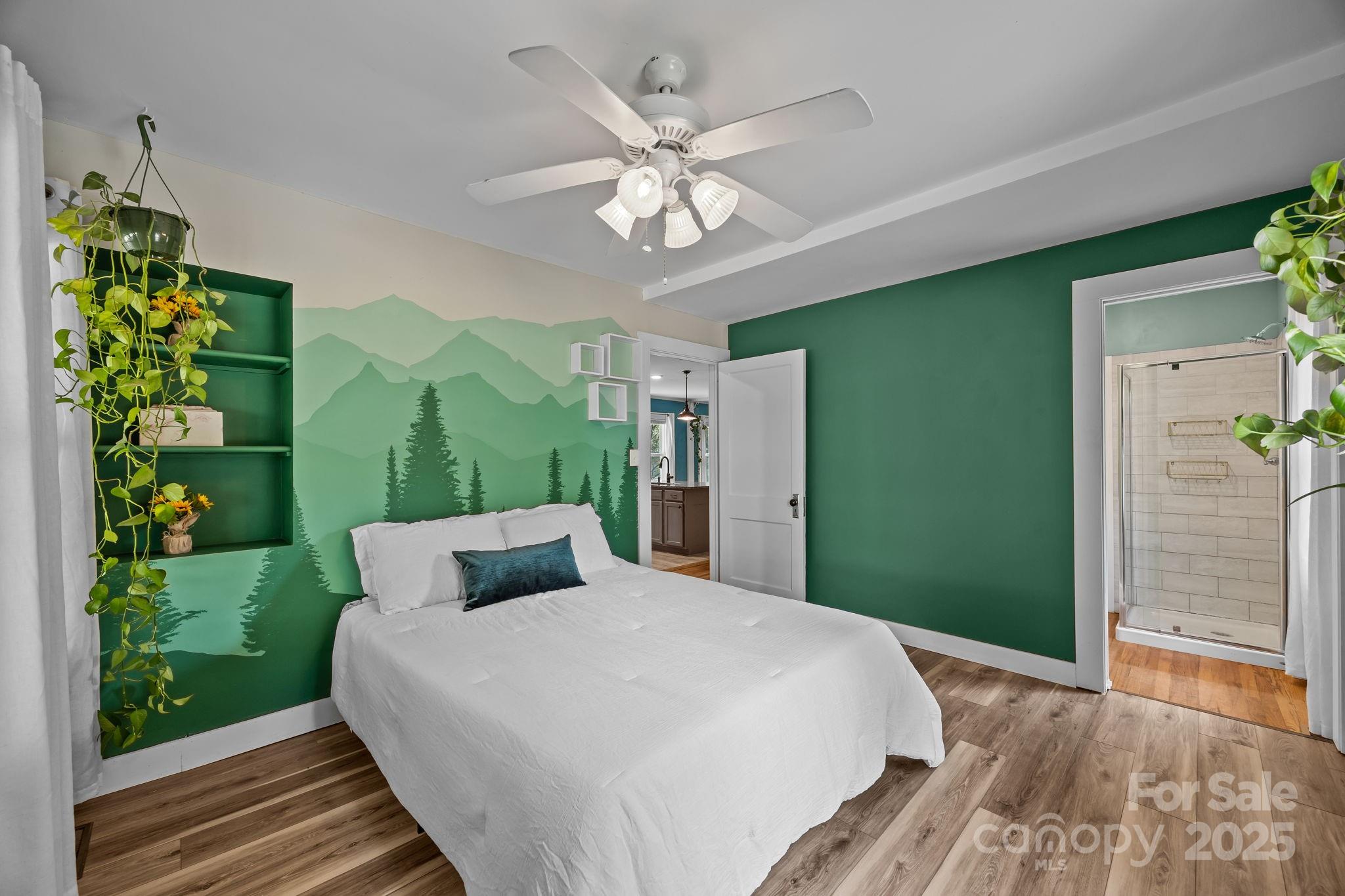 300 Gap Creek Road Fletcher, NC 28732 - Photo 26 of 48 a bedroom with a large bed chandelier and a window