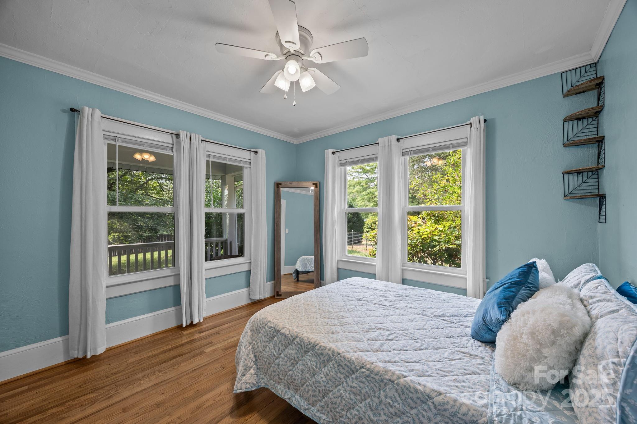 300 Gap Creek Road Fletcher, NC 28732 - Photo 36 of 48 a bedroom with a large bed and a large window