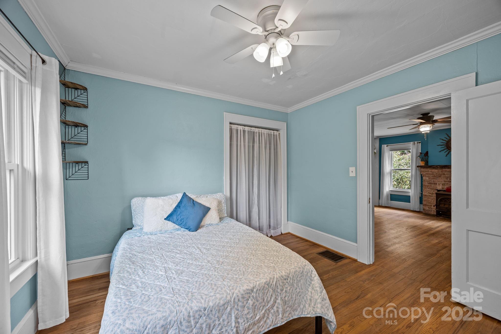 300 Gap Creek Road Fletcher, NC 28732 - Photo 37 of 48 a bedroom with a large bed and a chandelier