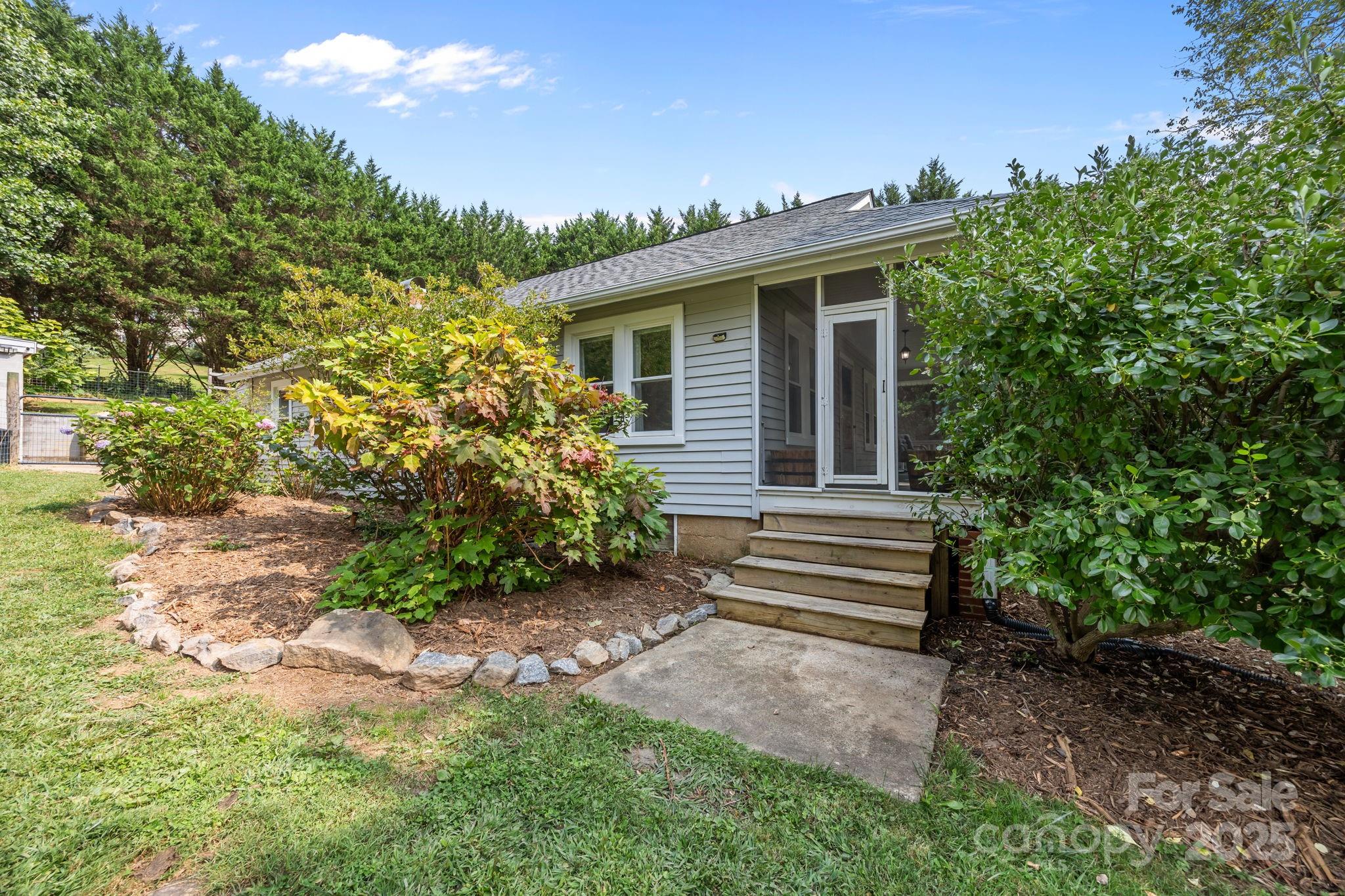 300 Gap Creek Road Fletcher, NC 28732 - Photo 41 of 48 a front view of a house with a garden