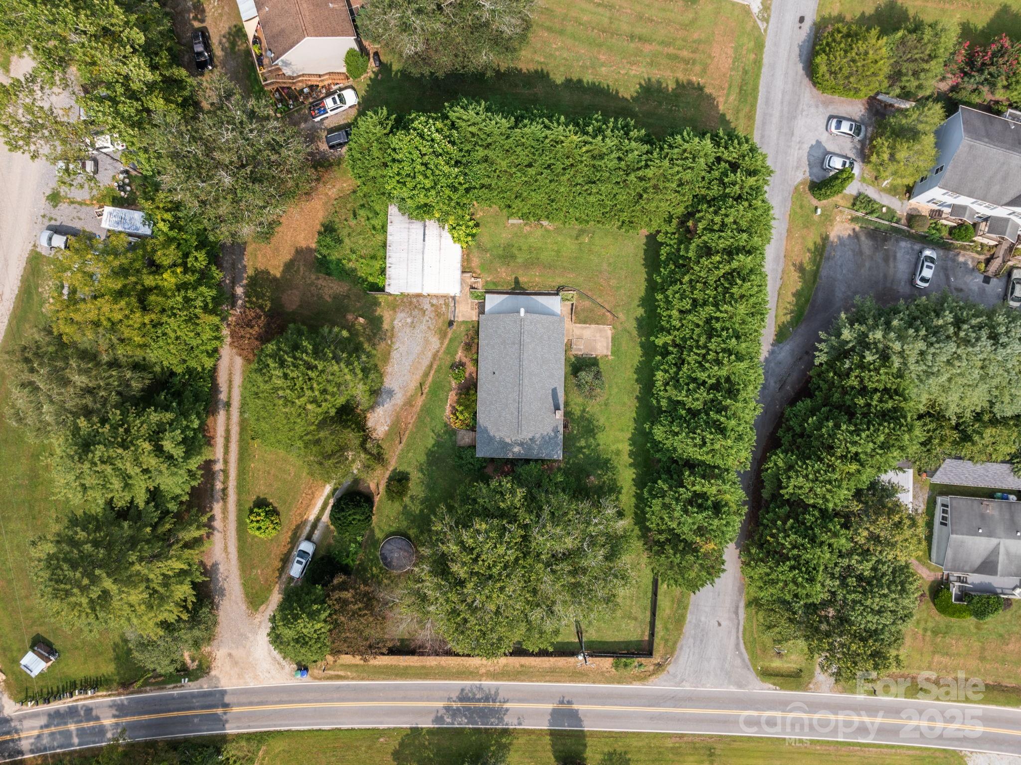 300 Gap Creek Road Fletcher, NC 28732 - Photo 48 of 48 an aerial view of a house with a yard and plants