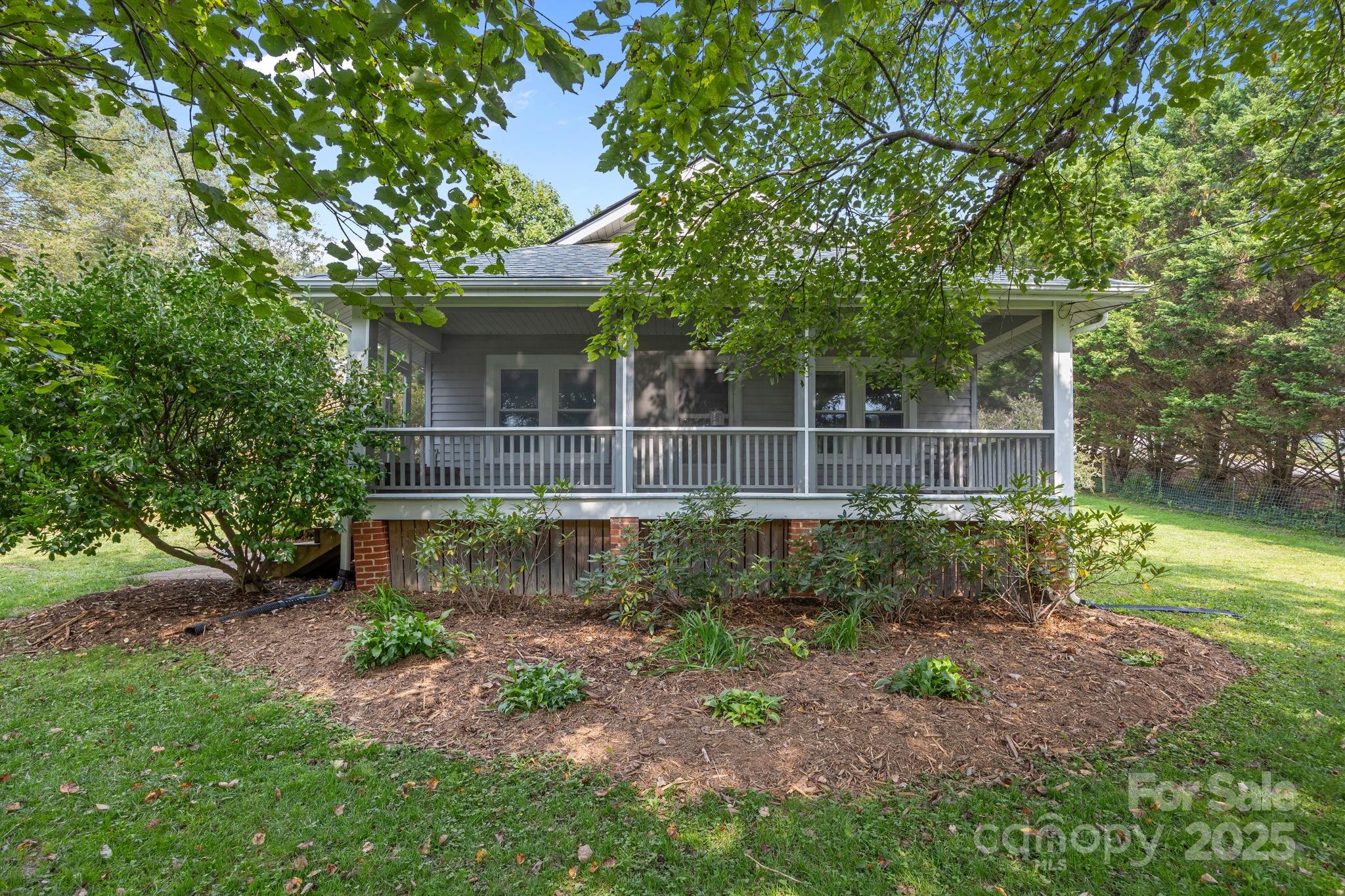 300 Gap Creek Road Fletcher, NC 28732 - Photo 6 of 48 a front view of a house with garden
