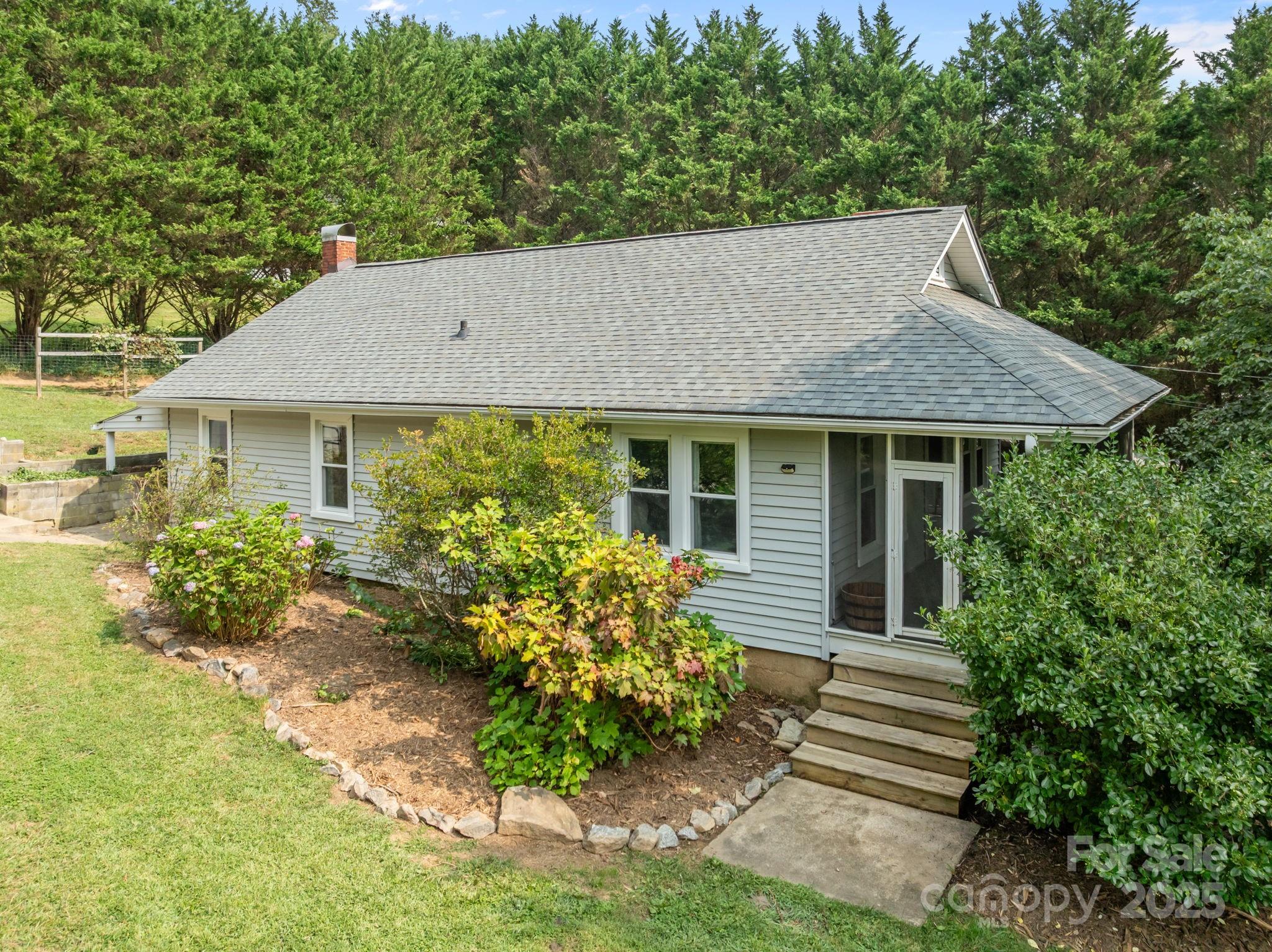 300 Gap Creek Road Fletcher, NC 28732 - Photo 8 of 48 a front view of a house with garden