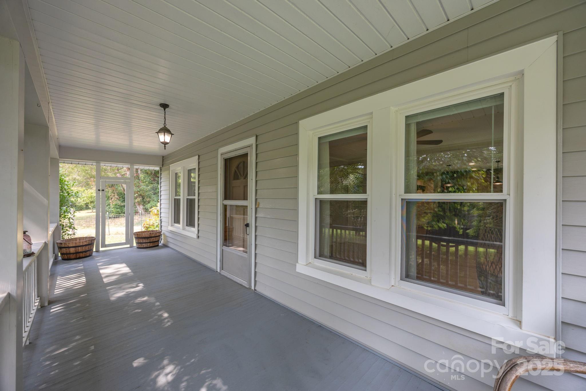 300 Gap Creek Road Fletcher, NC 28732 - Photo 10 of 48 a view of a hall with wooden floor and a large window