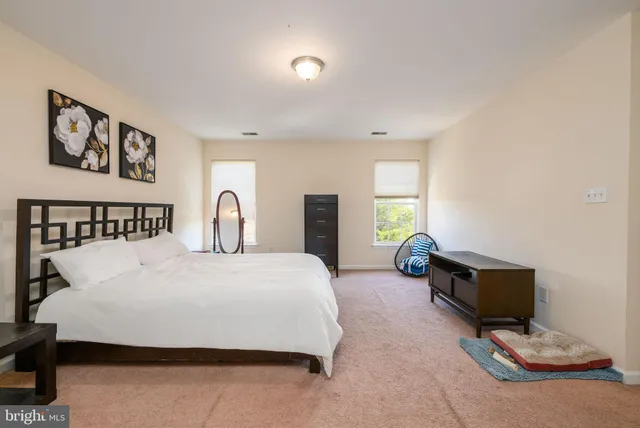 a bedroom with a bed and a table in it