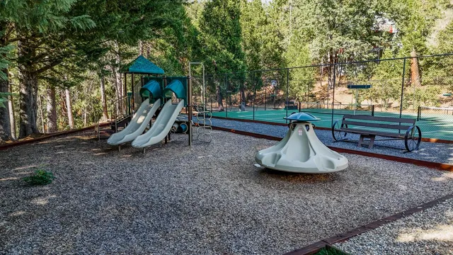 a view of outdoor space with a table and chairs
