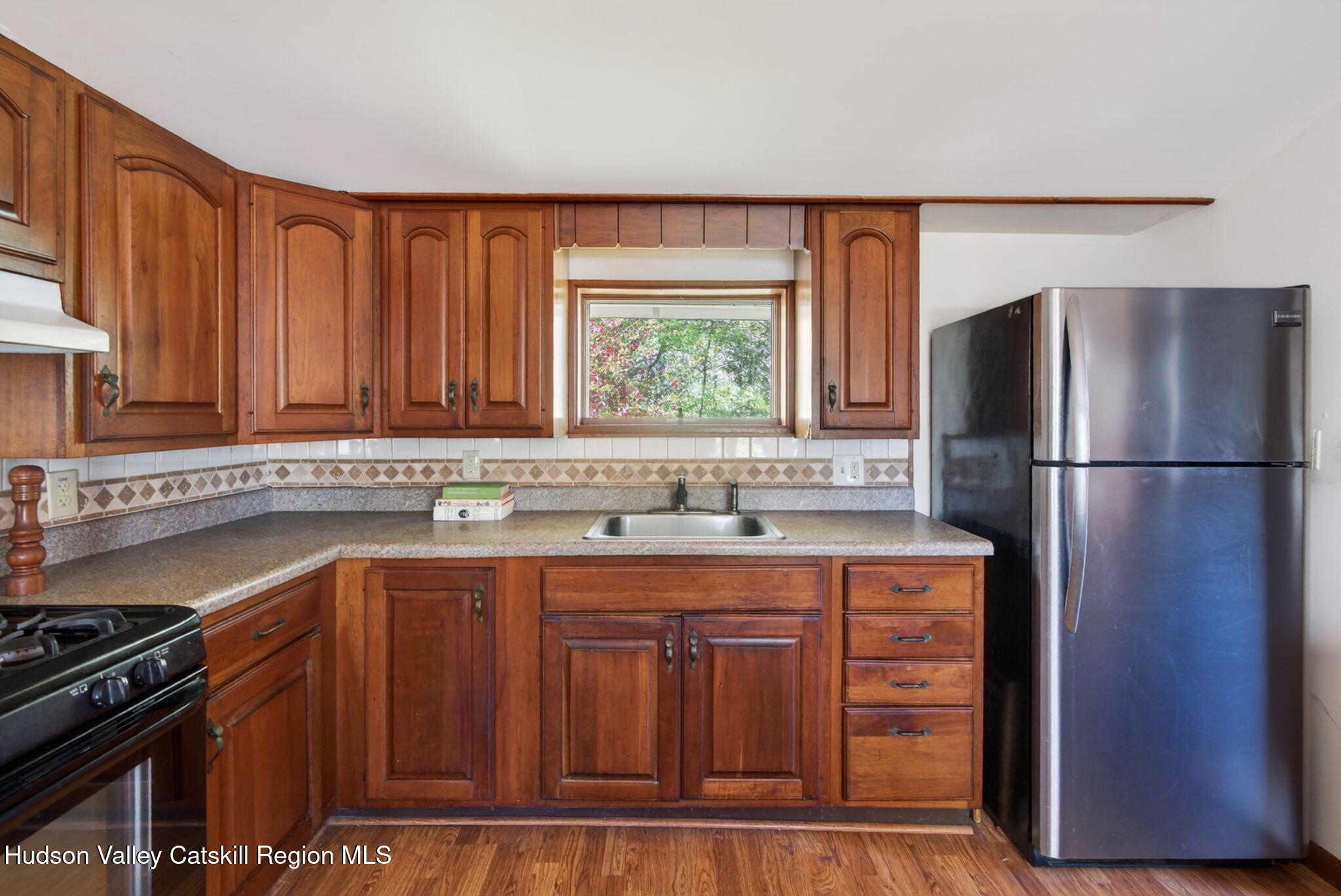 689 Old Road Windham, NY 12496 - Photo 6 of 42 a kitchen with a sink and a refrigerator