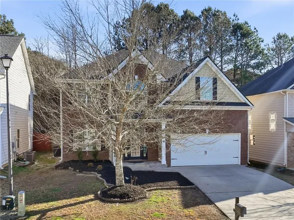 a aerial view of a house with a yard
