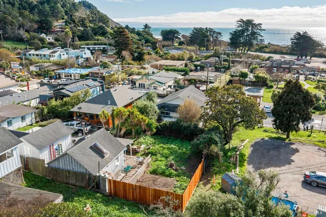 an aerial view of residential house with outdoor space and swimming pool