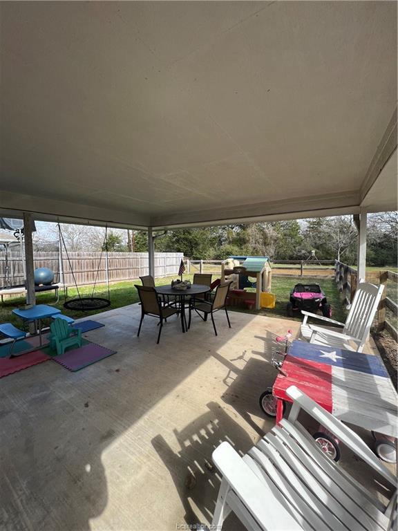 11349 North Dowling Road College Station, TX 77845 - Photo 15 of 16 a living room with furniture and a floor to ceiling window