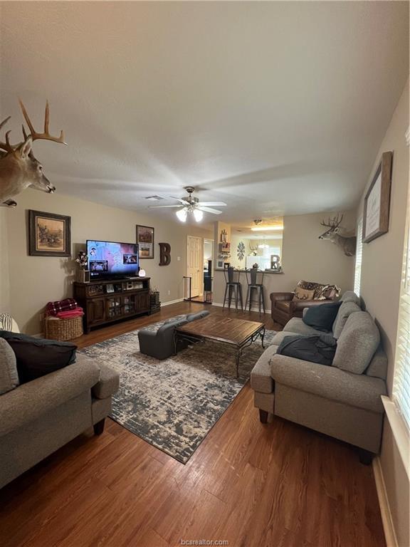 11349 North Dowling Road College Station, TX 77845 - Photo 2 of 16 a living room with furniture and wooden floor