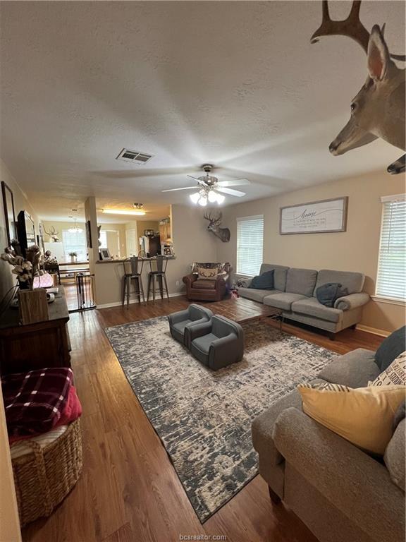 11349 North Dowling Road College Station, TX 77845 - Photo 3 of 16 a living room with furniture and a wooden floor