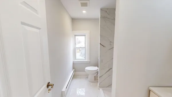 a bathroom with a shower curtain