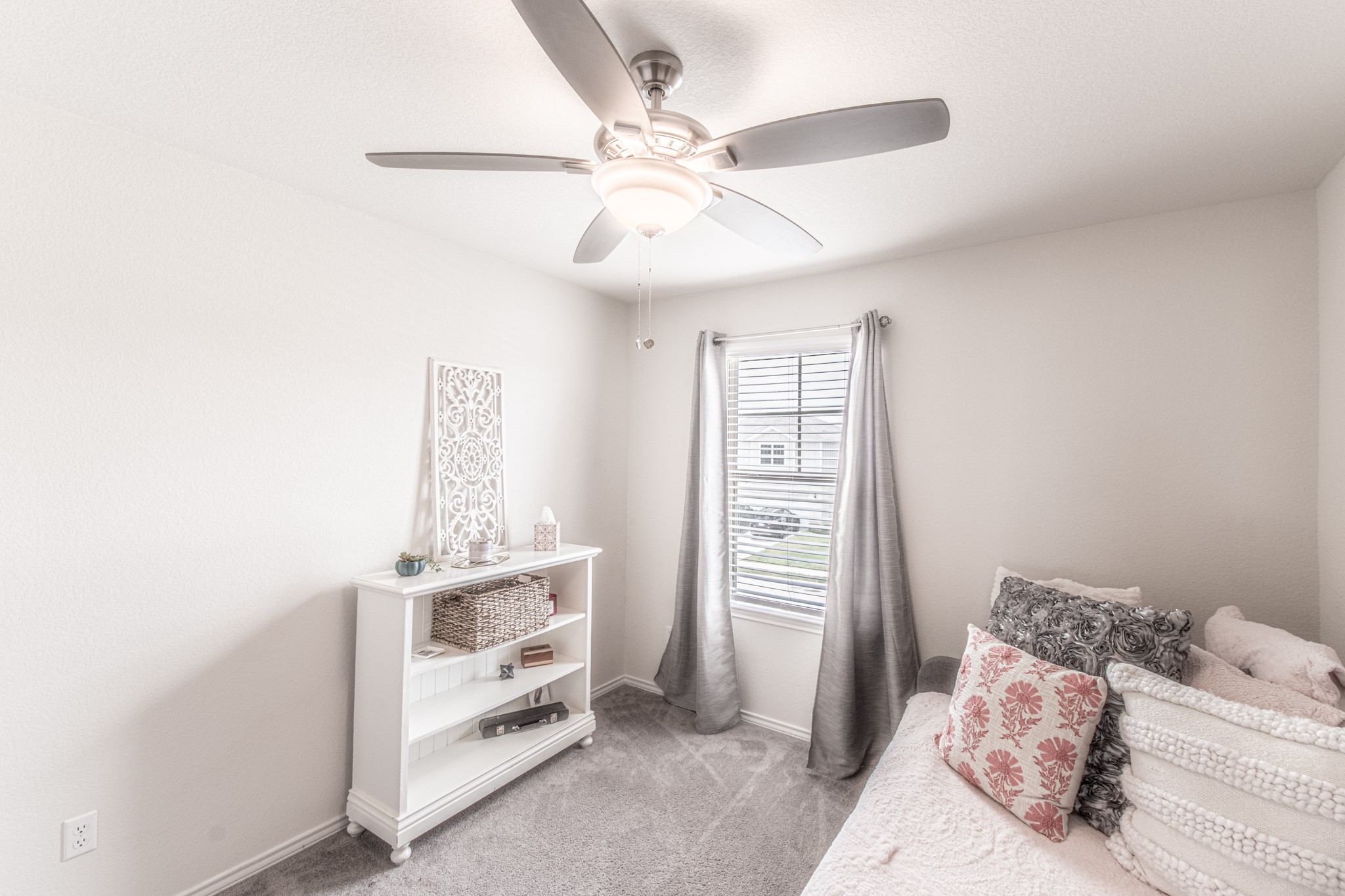 192 Spotted Rail Ridge Leander, TX 78641 - Photo 20 of 34 a bedroom with a bed and a window