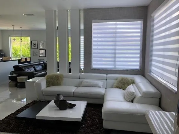 a living room with furniture and a window