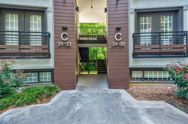 a view of a brick house with a large windows