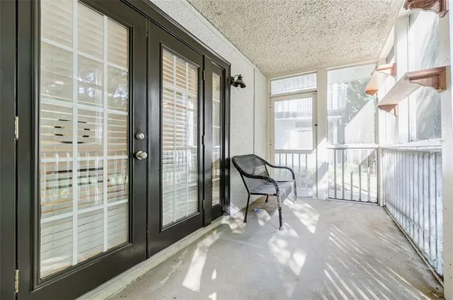 a view of a room with wooden floor and chair