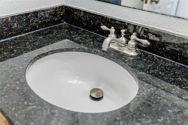 closeup of a sink with wooden floor