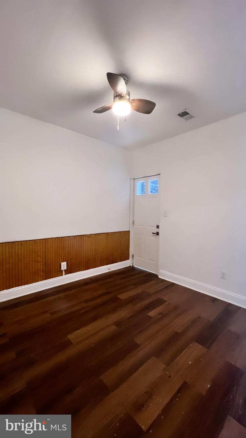 1345 1st Street Northwest, Unit 1 Washington, DC 20001 - Photo 11 of 17 a view of room with wooden floor and ceiling fan