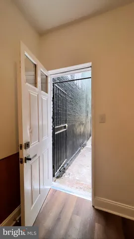a view of entryway with wooden floor