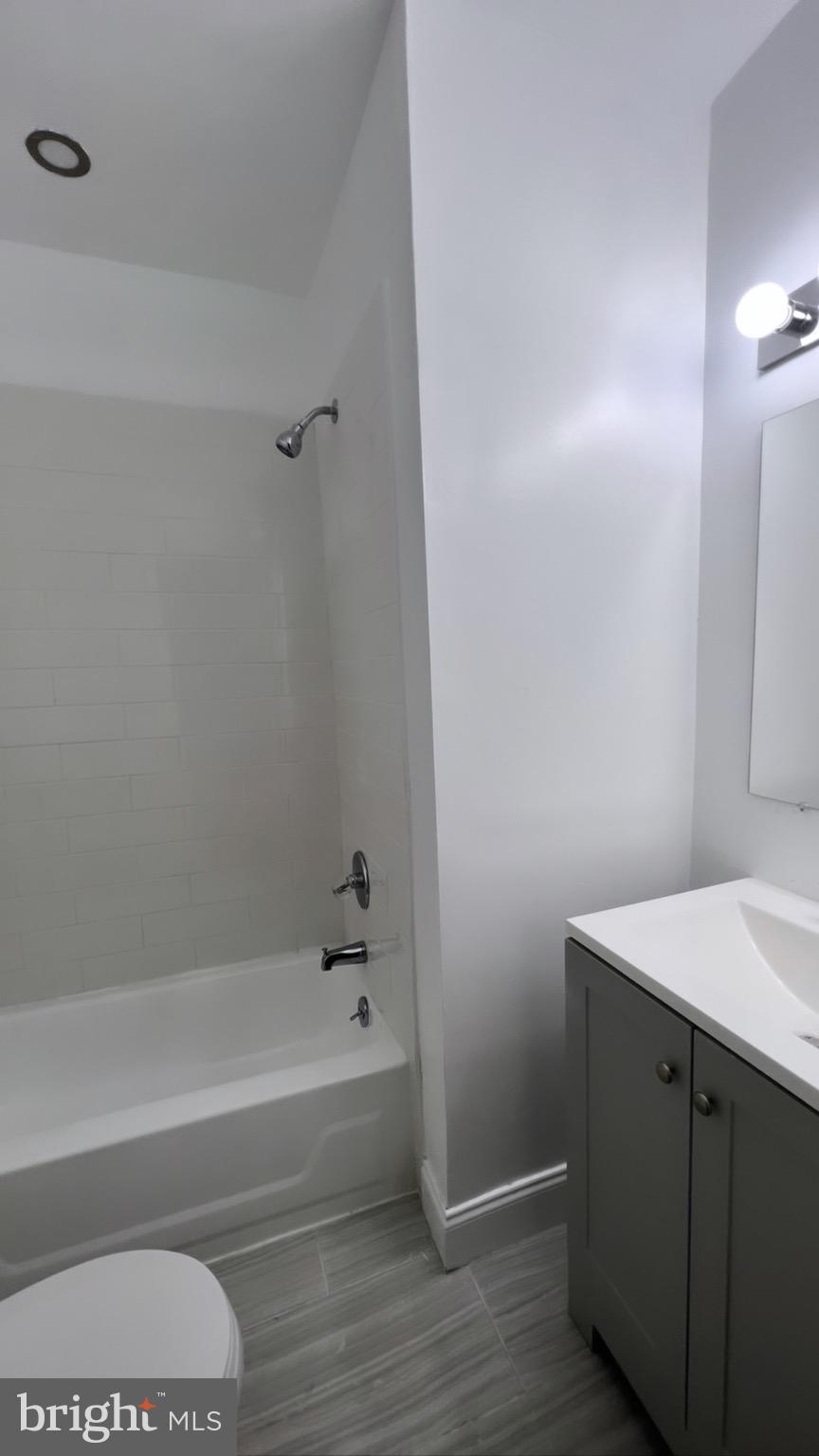 1345 1st Street Northwest, Unit 1 Washington, DC 20001 - Photo 15 of 17 a bathroom with a bathtub and a sink