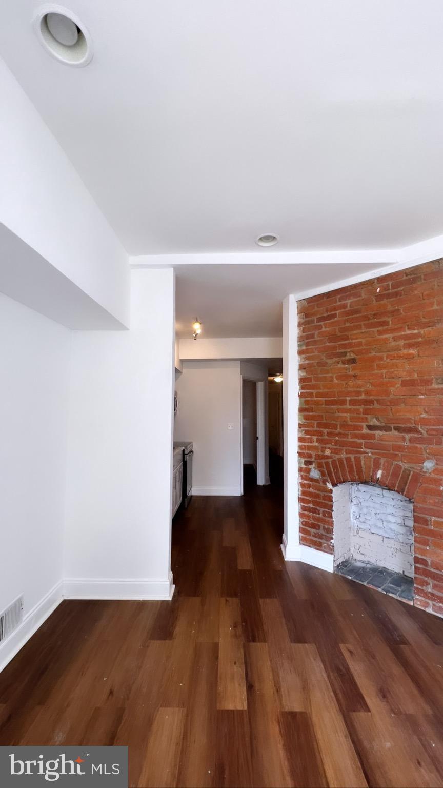 1345 1st Street Northwest, Unit 1 Washington, DC 20001 - Photo 5 of 17 a view of a livingroom with wooden floor