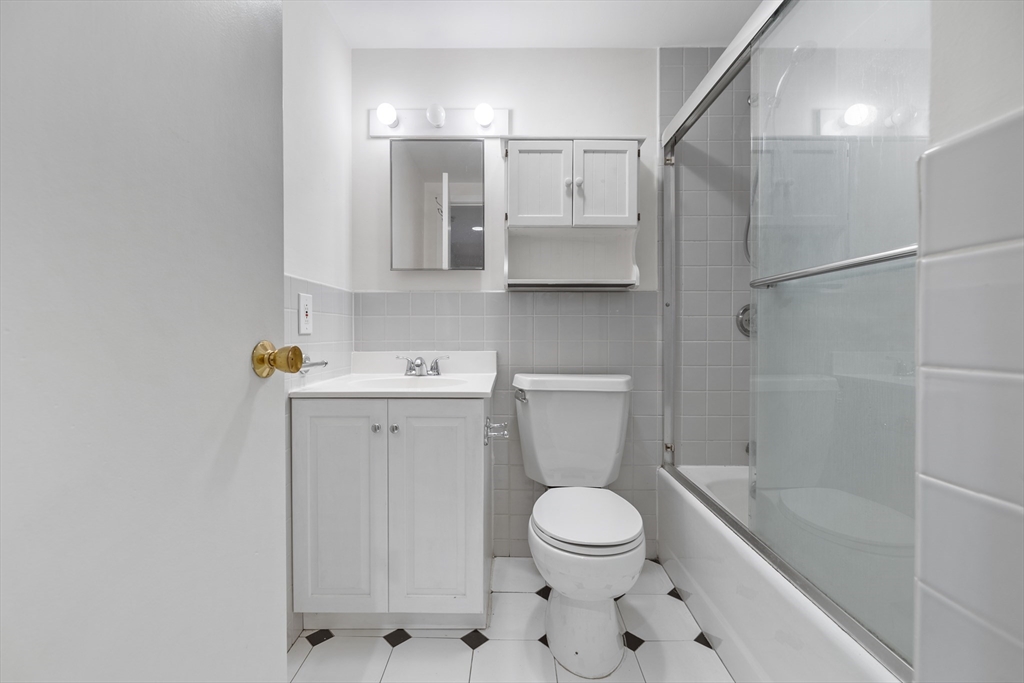 1763 Beacon Street, Unit A Brookline, MA 02445 - Photo 4 of 20 a bathroom with a toilet sink and shower