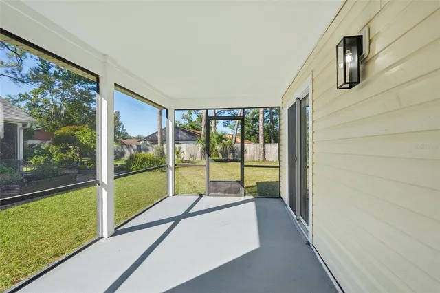 a balcony view with a glass door