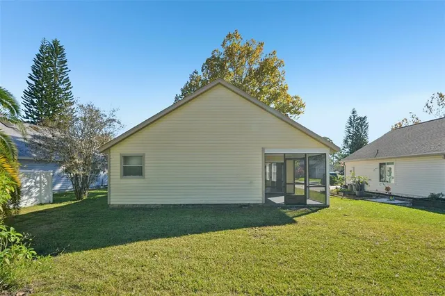 a view of a house with a backyard