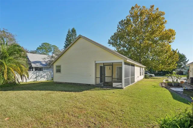 a view of a backyard of the house