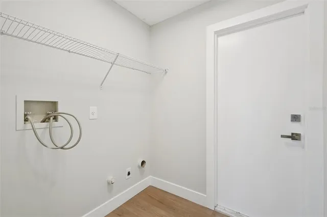 an empty room with a empty space and windows