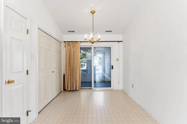 a view of a livingroom with a chandelier fan