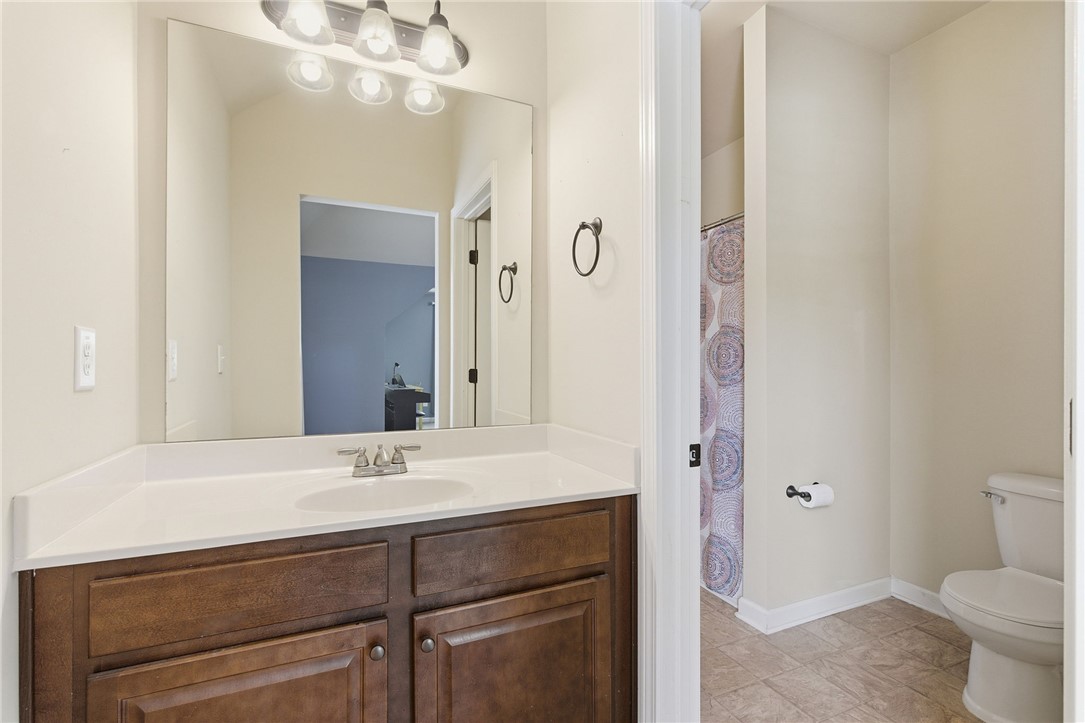 138 Buckland Drive Anderson, SC 29621 - Photo 35 of 49 This functional bathroom features a single vanity, a toilet, and a shower area with tiled flooring.