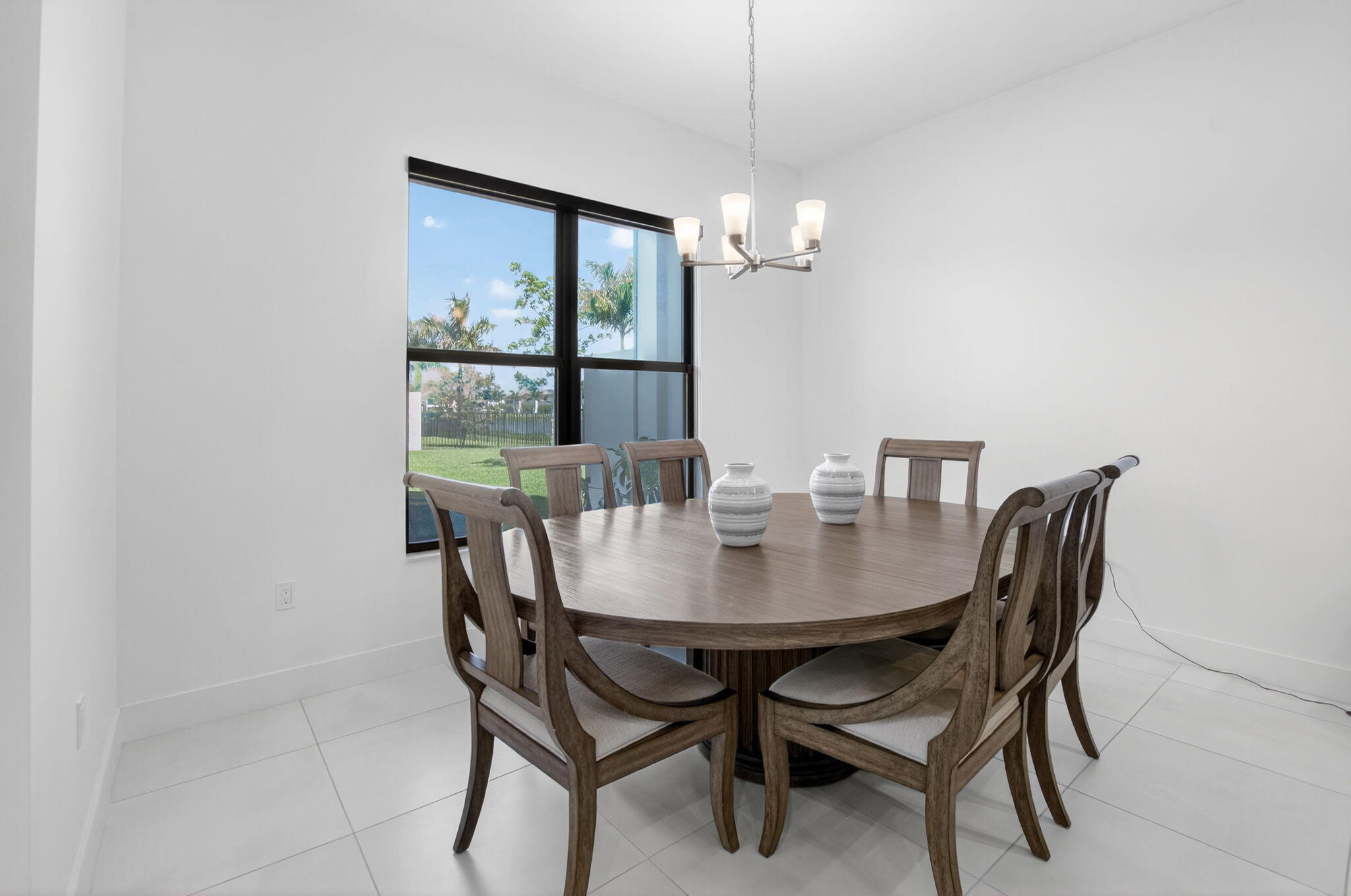 20278 Bandon Dunes Road Boca Raton, FL 33434 - Photo 31 of 113 a view of a dining room with furniture wooden floor and chandelier