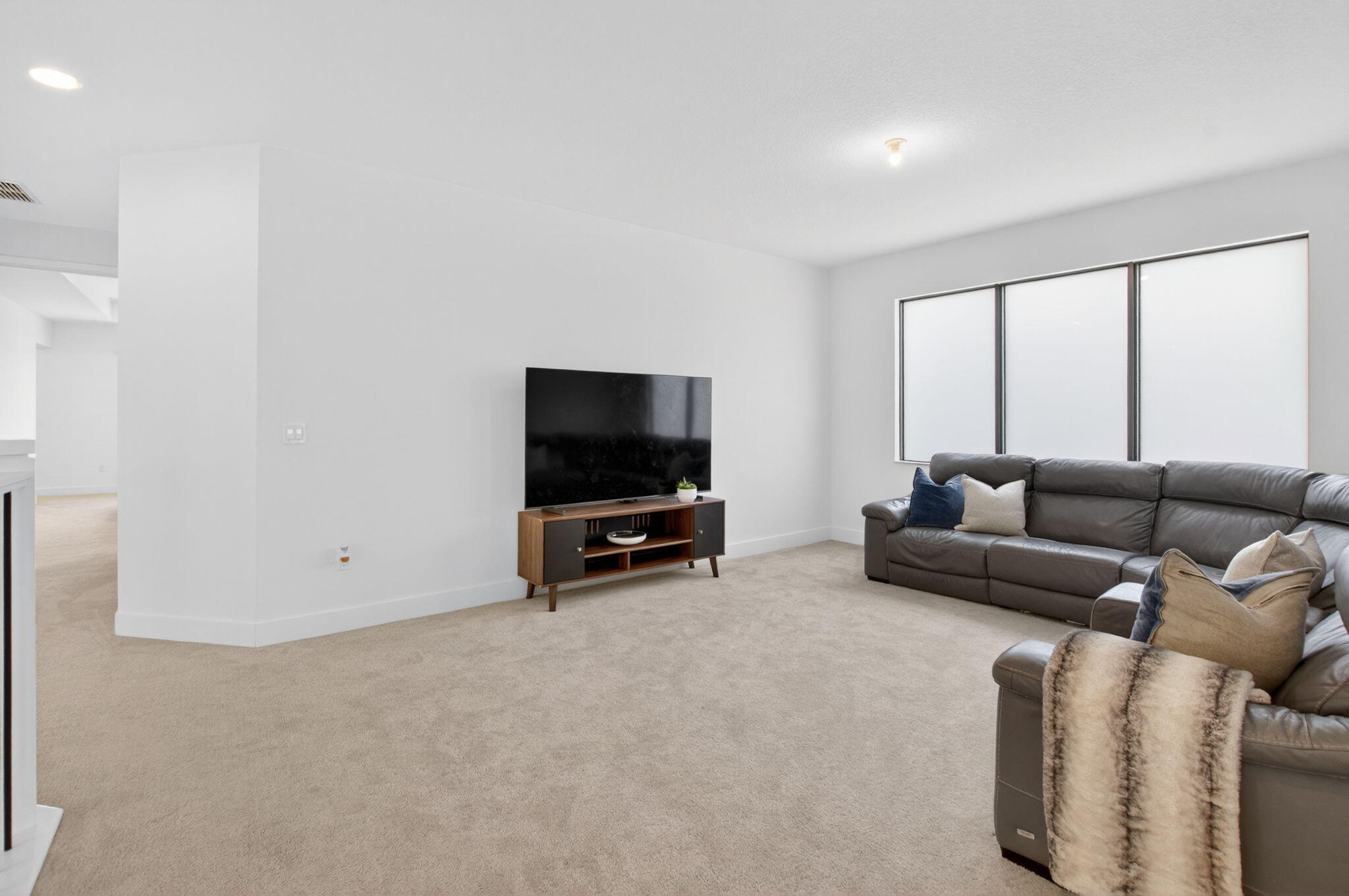 20278 Bandon Dunes Road Boca Raton, FL 33434 - Photo 37 of 113 a living room with furniture and a flat screen tv