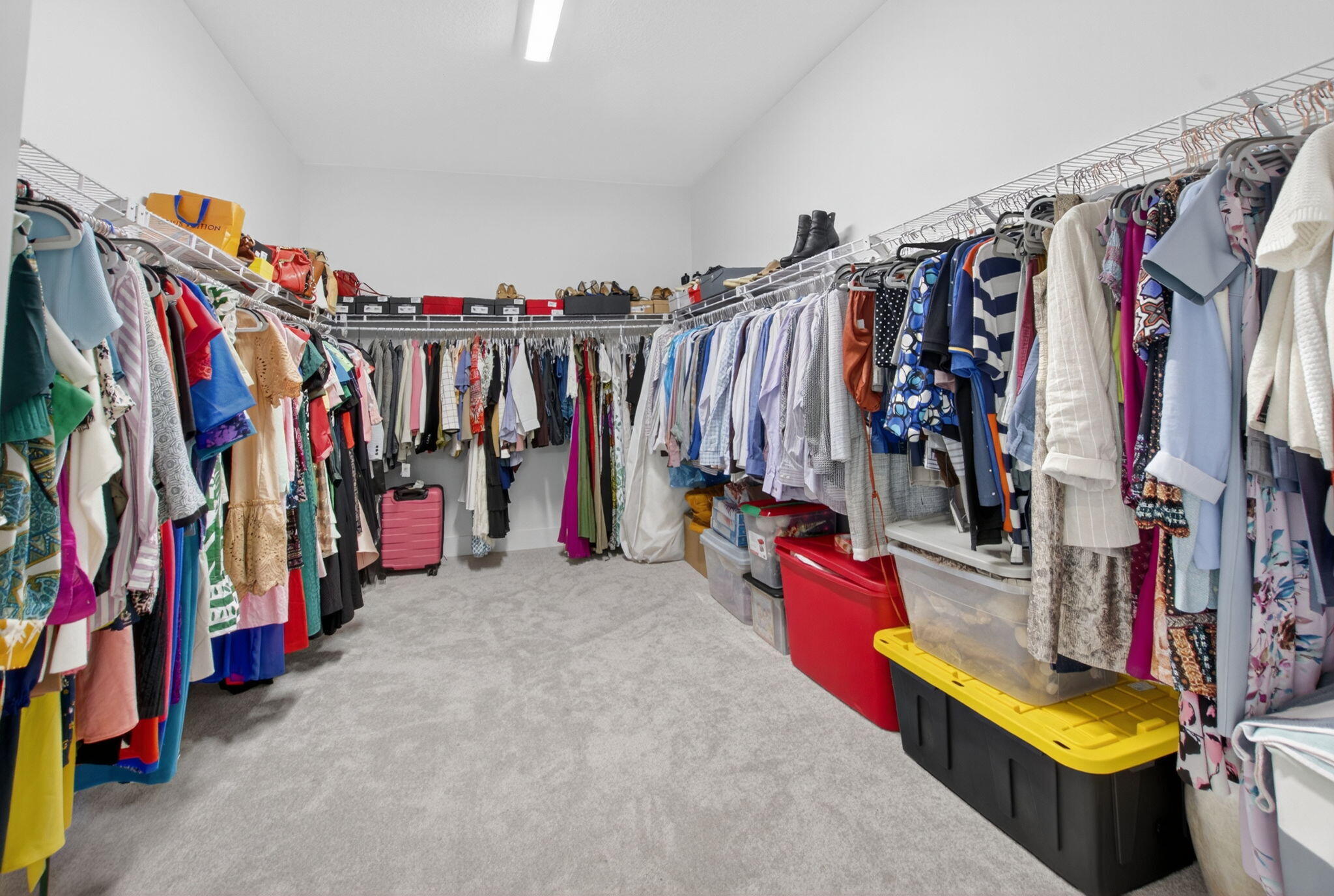 20278 Bandon Dunes Road Boca Raton, FL 33434 - Photo 47 of 113 a view of walk in closet with clothes